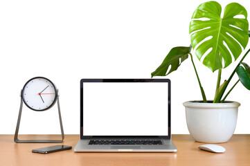 Fototapeta premium Blank screen of Laptop computer with smart phone, mouse, clock and monstera plant pot on wooden table, White background isolated