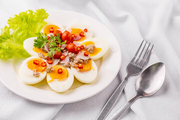 Boiled eggs on white plate