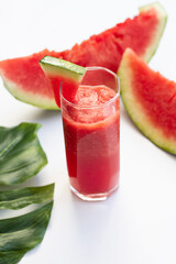 Watermelon smootie and watermelon slices on white background. 