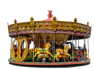 Old fashioned merry-go-round fairground attraction with horses, cart and a slay. Isolated on a...