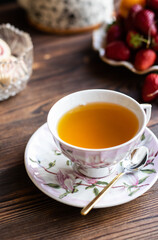 Obraz na płótnie Canvas cup of aromatic tea on a wooden table