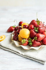 plate of juicy fresh seasonal berries