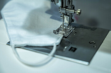 People sew the white face mask to protect themselves from the situation of Covid 19