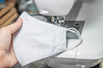 People sew the white face mask to protect themselves from the situation of Covid 19