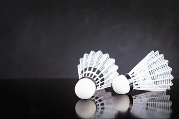 Shuttlecock for badminton isolated on dark background
