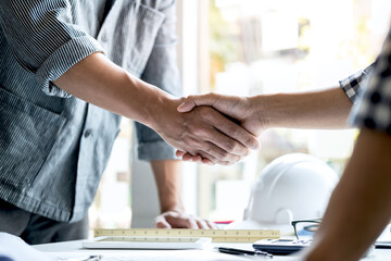 Finishing up a meeting, Two engineer or architect meeting for project, handshake after consultation...