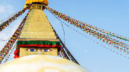 Close up on Buddha eyes on top of the white stupa at Boudhanath, Kathmandu, Nepal