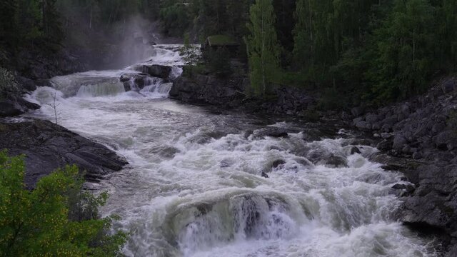 Water fall in Hallingdal, Norway. During spring a lot of water comes down from the mountains. 