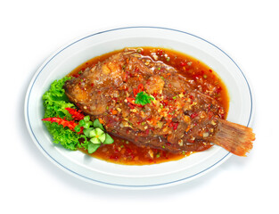 Fried Fish with Sweet and Spicy Sauce ontop Thai Food