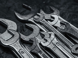 Fototapeta premium Wrenches, tools on grey stone table. Worker tools and equipments close-up.