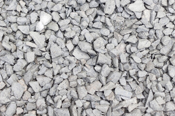 Gray pebbles background. Top view, copy space, texture