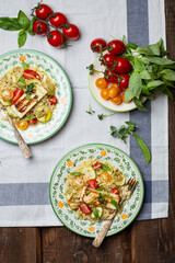 Ptitim or Israeli pasta with tomatoes and halloumi