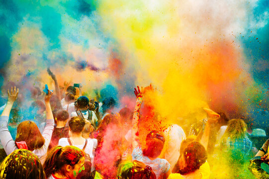 Holi color festival. Celebrating dances. Throwing colored powder. Spring Festival.
