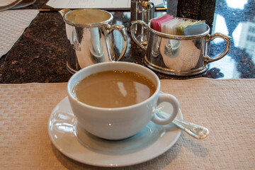 CHICAGO, ILLINOIS, UNITED STATES - DEC 11th, 2015: Hot cup of Coffee on table in a luxury restaurant