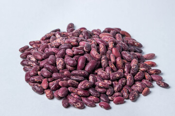 A handful of beans on a white background. Harvesting. Fresh natural beans