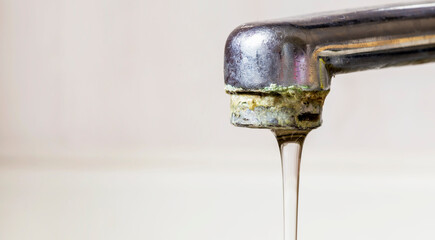 Old dirty kitchen water tap with lime, web banner with copy space