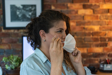 .smiling woman with face mask