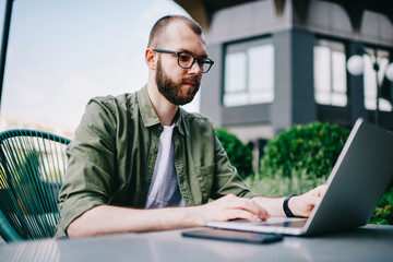 Smart man learning online using new modern laptop computer