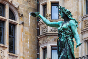 Part of statue of Hygieia, goddess of health and hygiene. Hygieia fountain in courtyard of Hamburg...