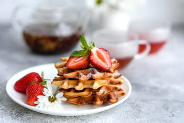 Delicious fresh baked belgian waffles with berries and fruit