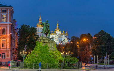 Fototapeta na wymiar Bohdan Khmelnytsky Monument with St. Michael's Golden-Domed Monastery on the background in Kyiv, Ukraine