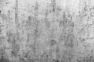 Texture of a concrete wall with cracks and scratches which can be used as a background