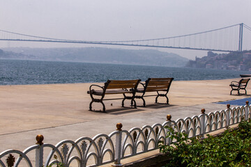 empty wooden benches by the seaside. Istanbul Bosporus. Empty streets of Istanbul from Lock down. Quarantine days in Turkey