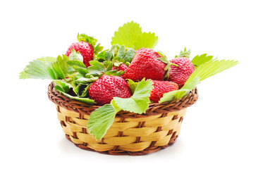 Ripe strawberry with leaves in the basket.