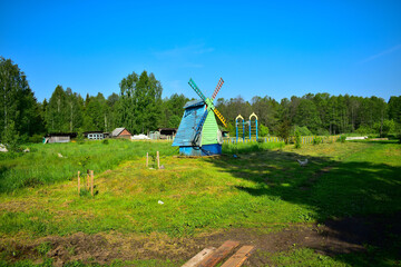 imitation of a village mill in the grass