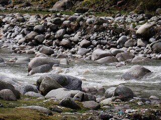 Flowing water in a rocky river bed ofo Beas River, India
