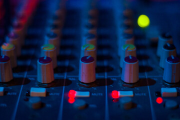Fototapeta premium DJ controller and color Light Music Instrument Backgrounds. Audio mixer ..