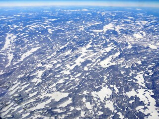 Aerial shot above Minnesota with snow covering the ground in winter