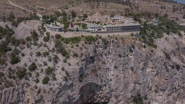 Areal view of cliff at sea with town and curch in Thassos in Greece
