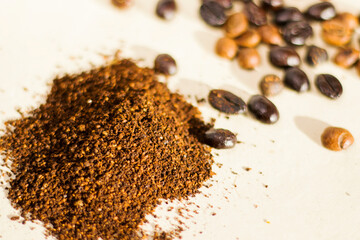 Coffee beans and powder coffee on the white background, studio shoot.
