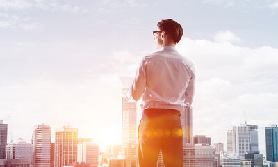 Concept of business success and control with confident boss against cityscape background