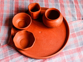 Mud crockery in blurred background