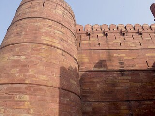 Upward close up shot of the walls of the Agra Fort, a UNESCO World Heritage site in India.