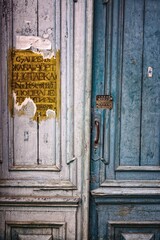 Old wooden door with code lock close-up view