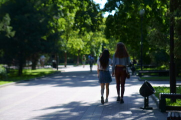 Blurred background. People walk on the streets of the city.