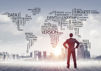 Motivation and inspiration concept with modern cityscape and businessman observing it