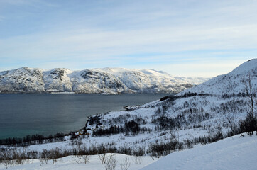 snowy mountain with sunshine blue sky and fjord landscape