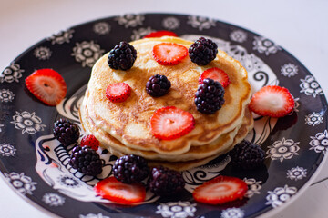 Homemade pancakes with blackberries and strawberries