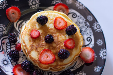 Homemade pancakes with blackberries and strawberries
