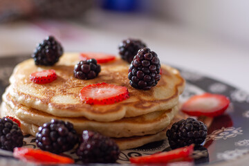 Homemade pancakes with blackberries and strawberries