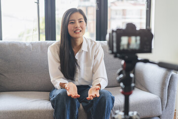asian teenage talk to camera recording footage for social media clip