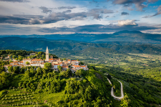 Aerial view of Pedena with mountains in the background on cloudy day in Pican, Croatia