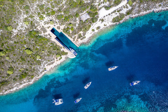 Aerial view of boats in Ex. Yugoslavian military shelter for submarines, Rogacic, Croatia