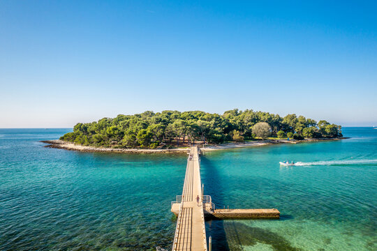 Aerial view of Koversada island surrounded by turquoise water in sunny day, Croatia