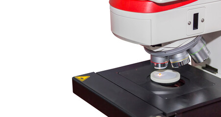 Close up modern microscope for science laboratory or industrial work connect with computer on table...