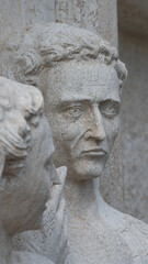 Obraz premium Ancient aged sculpture of Venetian people at Doge Palace facade in Venice, Italy